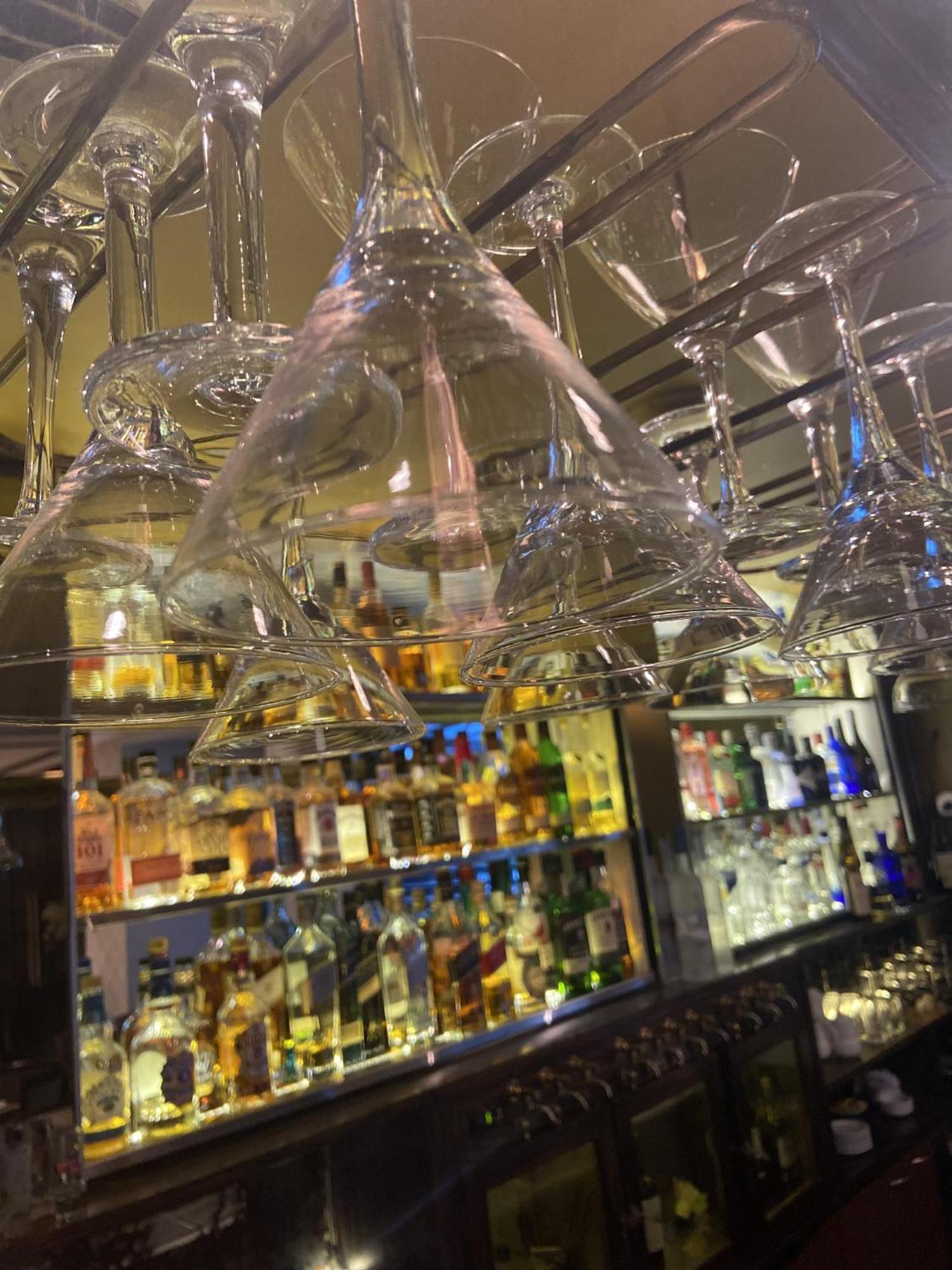 Regal Pacific Puerto Madero Hotel Buenos Aires Kültér fotó Wine glasses hanging above a bar